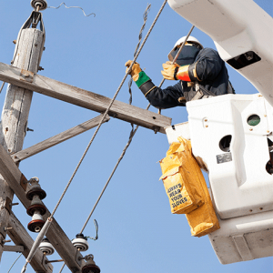 Utility worker in a bucket truck